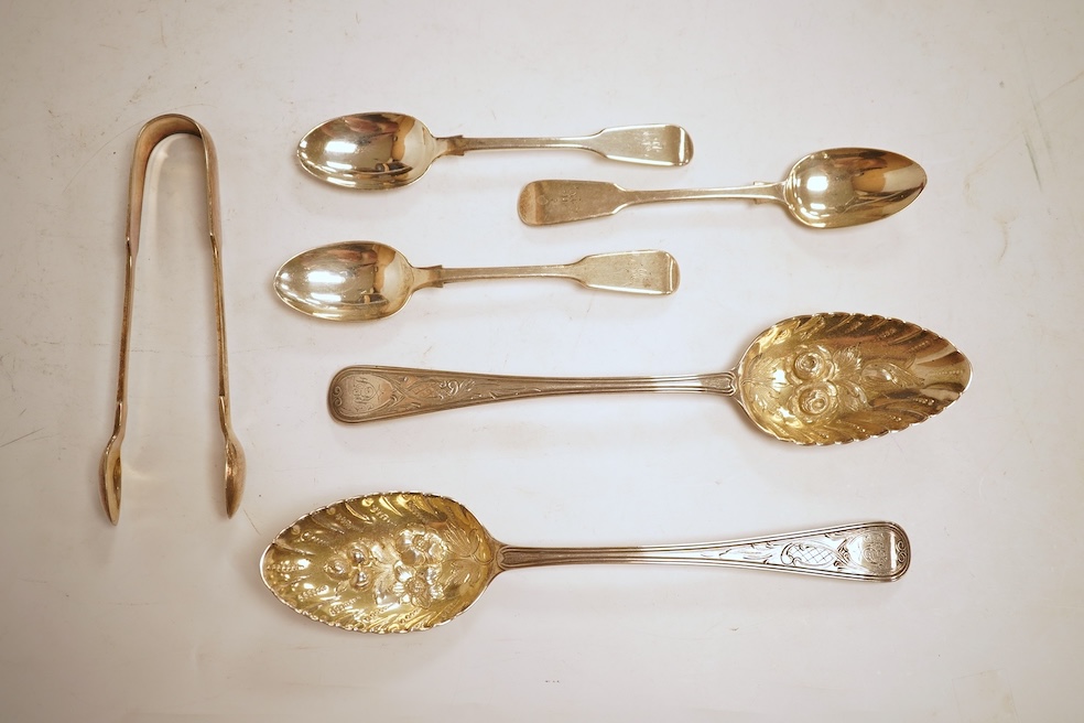 A pair of George III silver Old English pattern berry spoons, by Eley, Fearn & Chawner, London, 1810, 22.1cm, together with three Victorian silver fiddle pattern teaspoons, 6.8oz, together with a pair of plated sugar ton